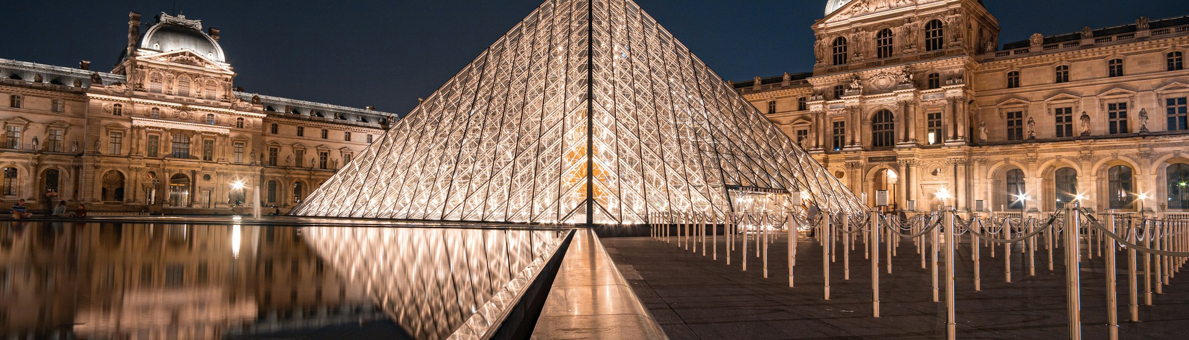 The Louvre pyramid illuminated at night