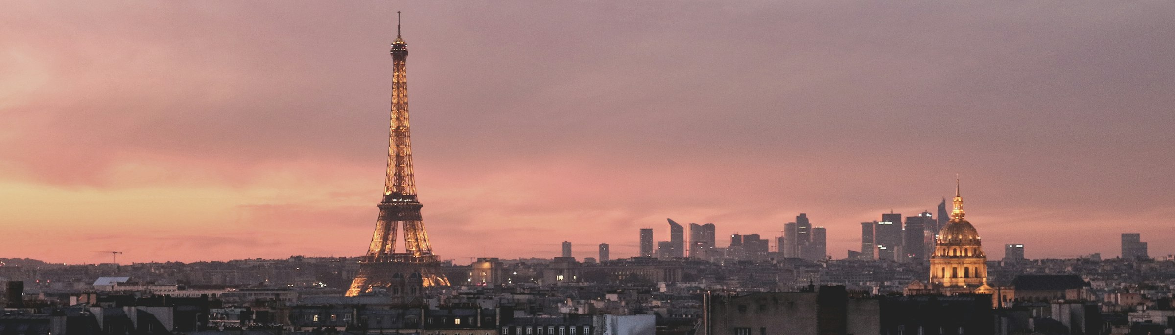 The Paris skyline at dusk with the Eiffel Tower